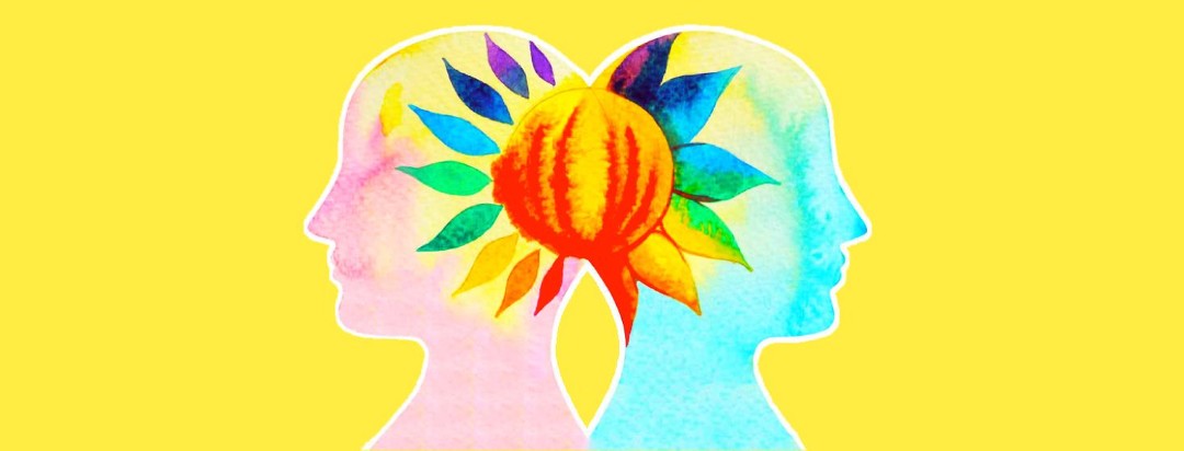 Two people standing back to back with a flower blooming between their heads.