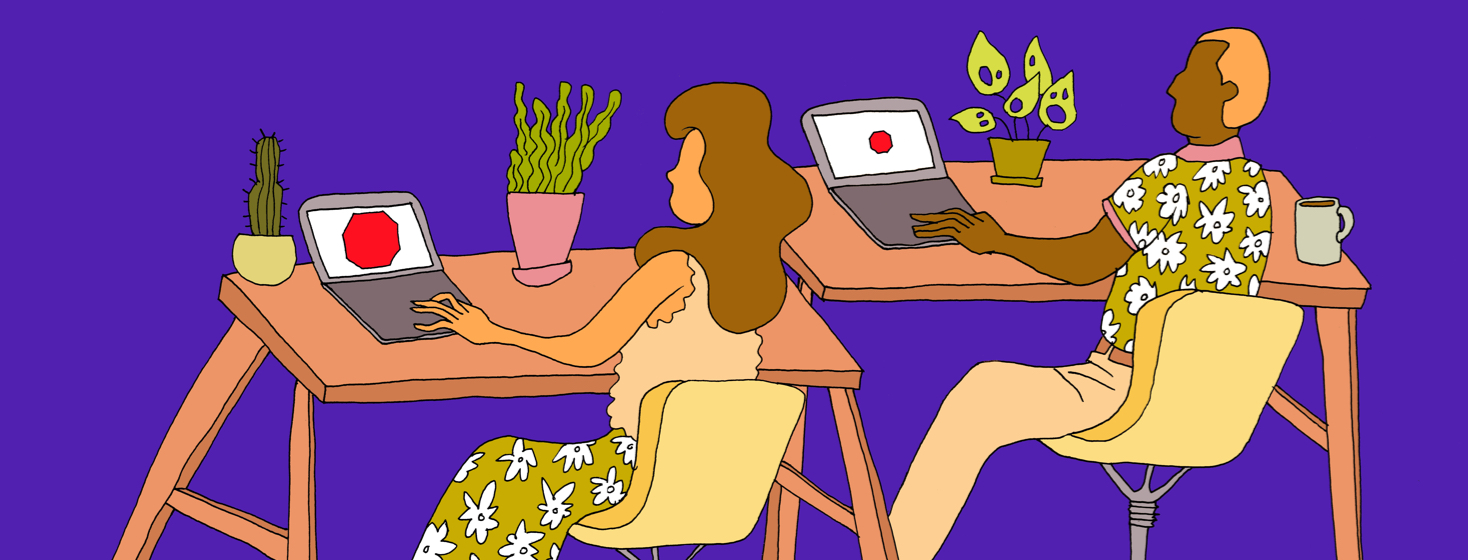 Two people working side by side in an office. One person has a tiny red dot on their screen and the other has a very large red spot.