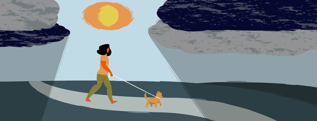 A woman walking her dog while the sun that is shaped like an eye shines through