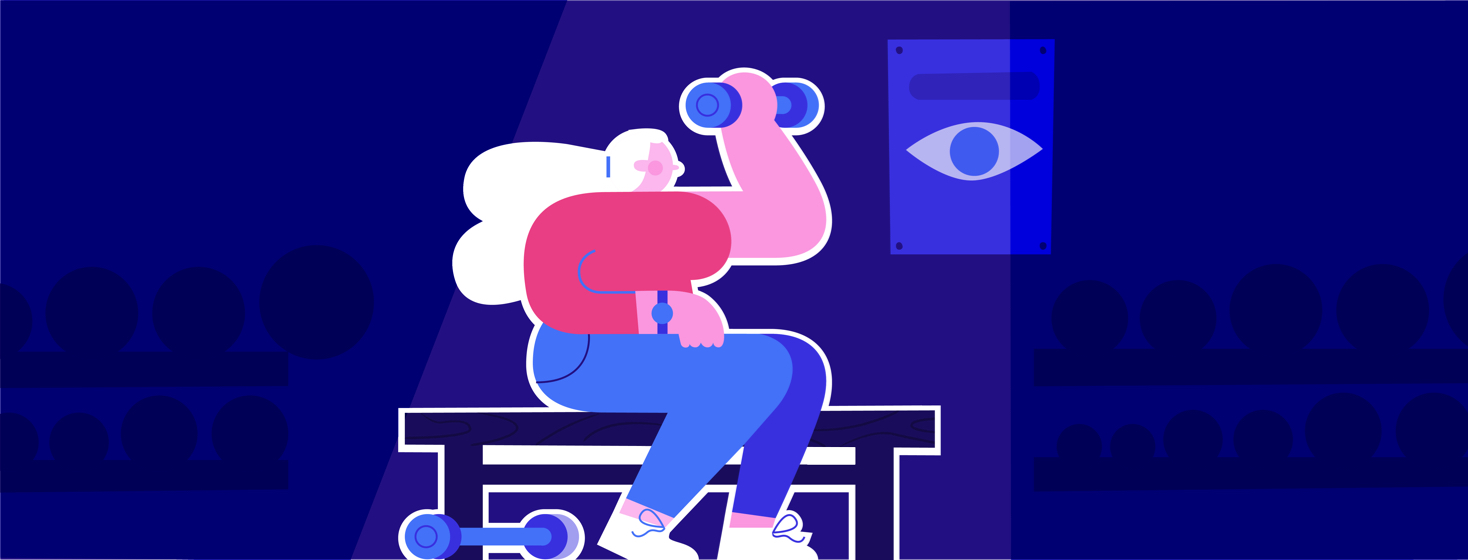 A woman is lifting weights at a gym. There is a poster in front of her with an eye on it.