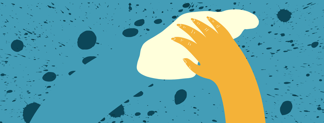 A yellow hand using a cloth to wipe across a surface and clean up a blue splattered spill.