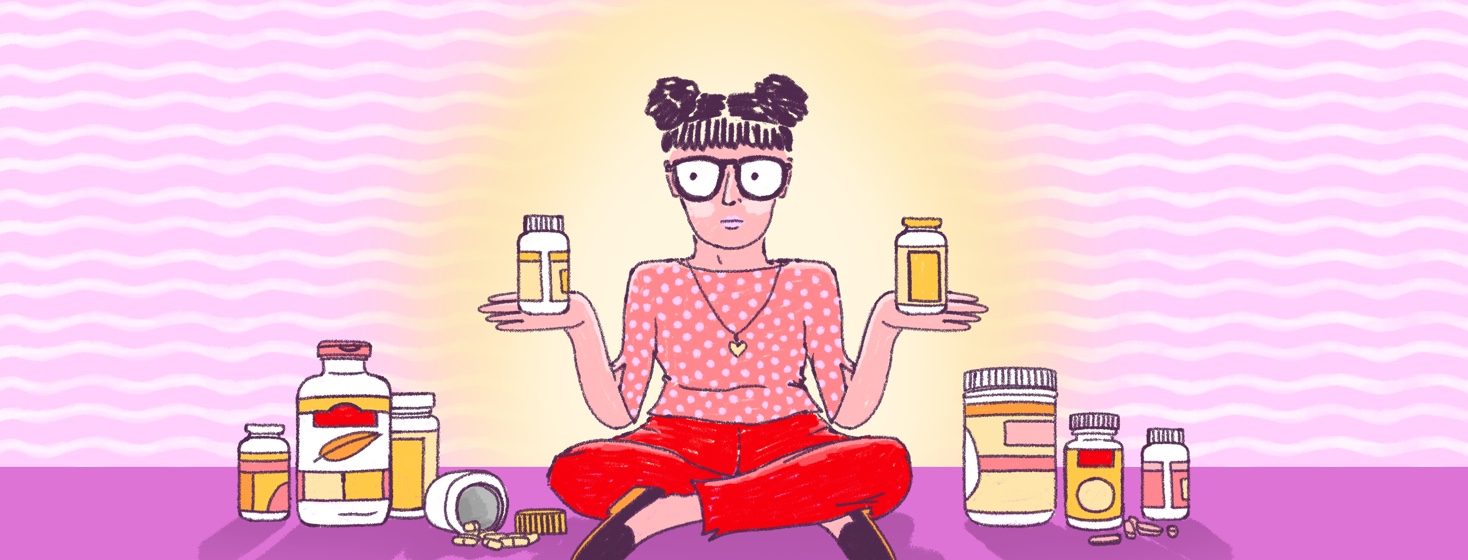 A woman sits on the ground surrounded by pill vitamin supplement bottles with one in each hand