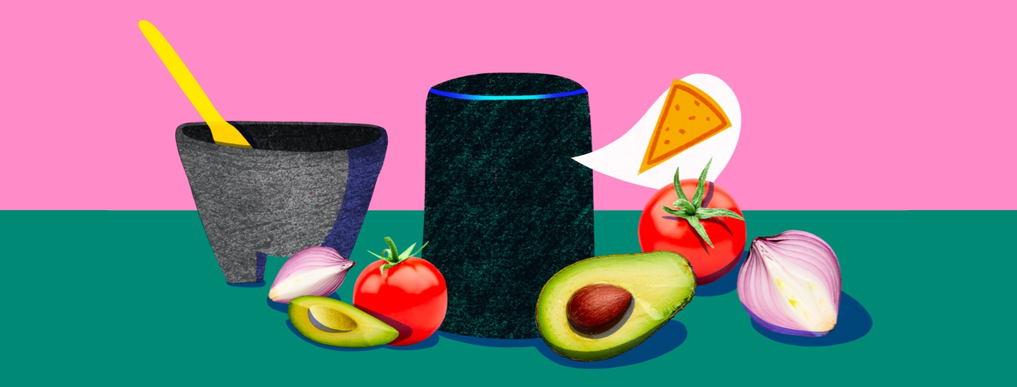 A smart speaker with tomatoes, onions, and avocados around it