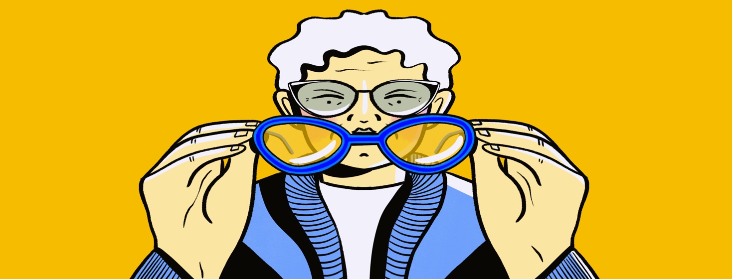 Senior woman wearing glasses holding new glasses