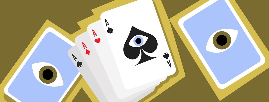 A deck of cards with four aces spread out with an eye in the middle.